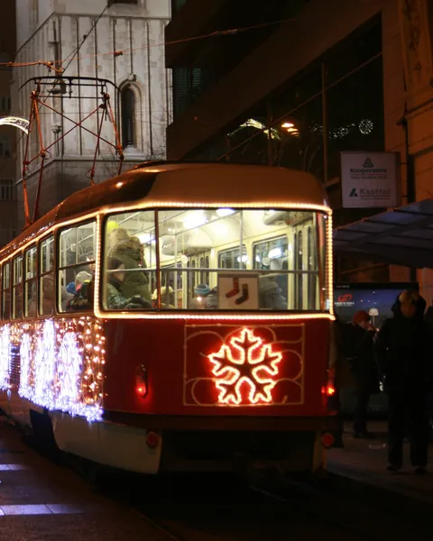 An illuminated Christmas tram in the streets of Brno